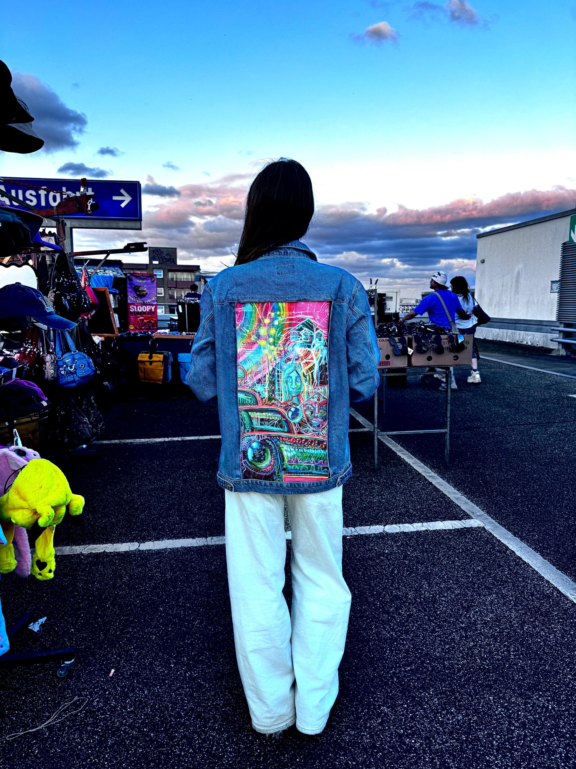 Customer wearing a YAGI jacket, back view with art panel
